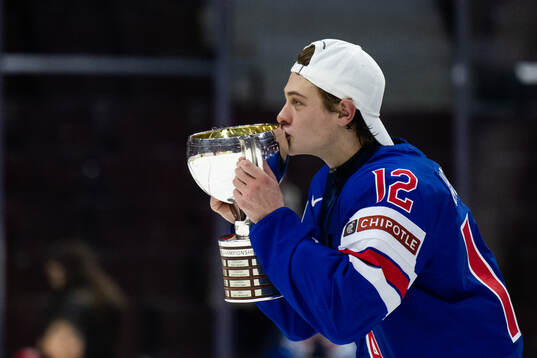 James Hagens of USA celebrates with the trophy