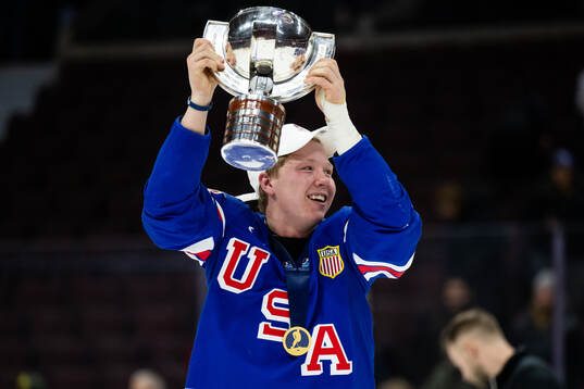 Max Plante of USA celebrates with the trophy