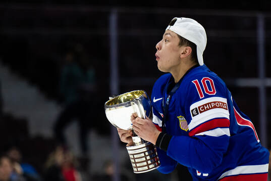 Carey Terrance of USA celebrates with the trophy