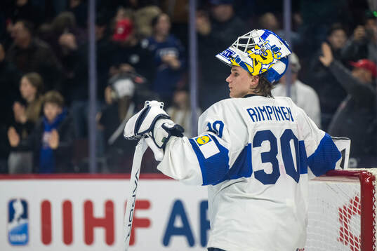 goaltender Petteri Rimpinen of Finland looks dejected