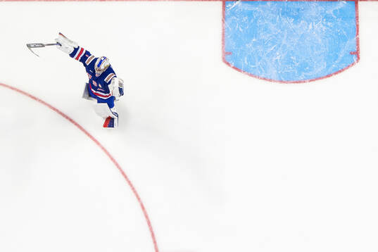 Goaltender Trey Augustine of USA celebrates