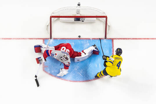 Axel Sandin-Pellikka of Sweden scores