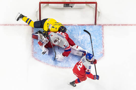 Axel Sandin-Pellikka of Sweden against goaltender Michael
