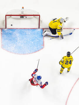 Goaltender Marcus Gidlöf and Tom Willander of Sweden look