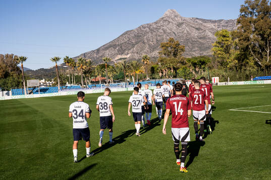 The players entering the pitch