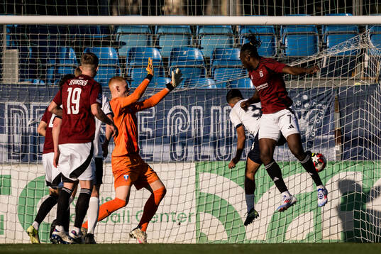 Goalkeeper Joakim Persson of Malmö FF and Victor Olatunji
