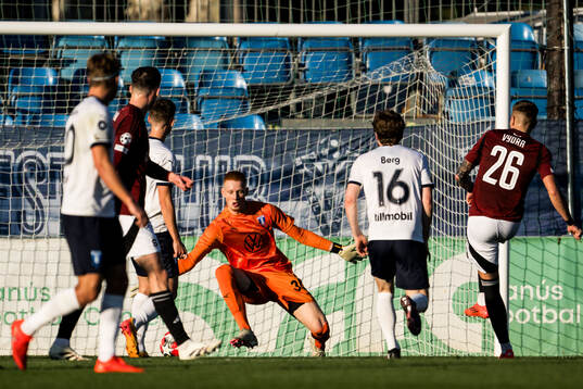 Goalkeeper Joakim Persson of Malmö FF and Patrik Vydra of