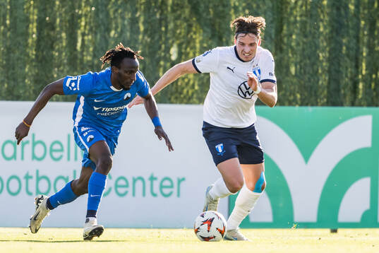 Lukas Letenay of Slovan Liberec and Jens Stryger Larsen of
