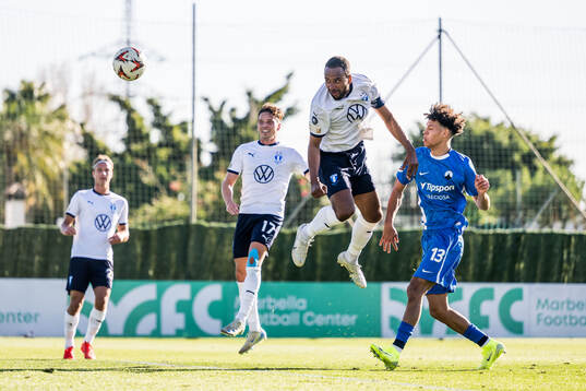 Isaac Kiese Thelin of Malmö FF and Kenny Ogboi of Slovan