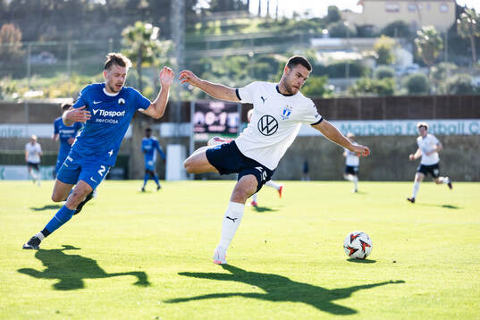 Dominik Plechaty of Slovan Liberec and Gabriel Busanello of
