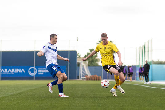 Piotr Wlazlo of FKS Stal Mielec and Emil Holten of Elfsborg