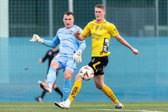 Goalkeeper Jakub Madrzyk of FKS Stal Mielec and Emil Holten