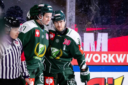 Viktor Lodin and Michael Lindqvist of Färjestad celebrate
