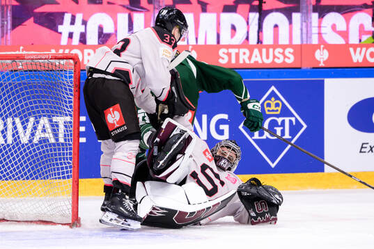 Tomas Tomek of Sparta Prague and goaltender Jakub Kovar of