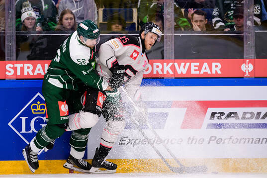 August Tornberg of Färjestad  and Jani Lajunen