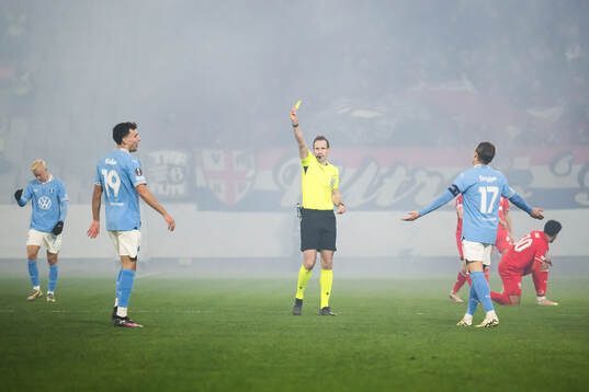 Colin Rösler of Malmö FF receives a yellow card by
