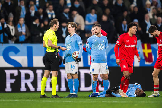 Referee Sascha Stegemann and Oliver Berg with Taha Ali of