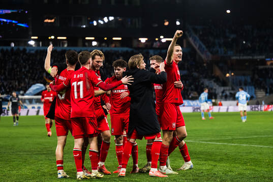 Players of of Twente celebrate