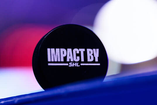 Matchpuck med Impact by SHL logo