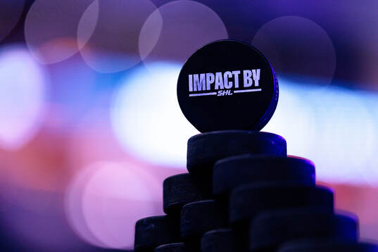 Matchpuck med Impact by SHL logo