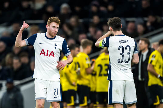 Dejan Kulusevski and Ben Davies of Tottenham Hotspur
