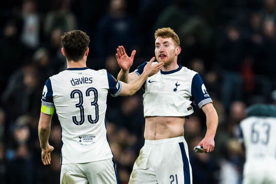 Ben Davies and Dejan Kulusevski of Tottenham Hotspur