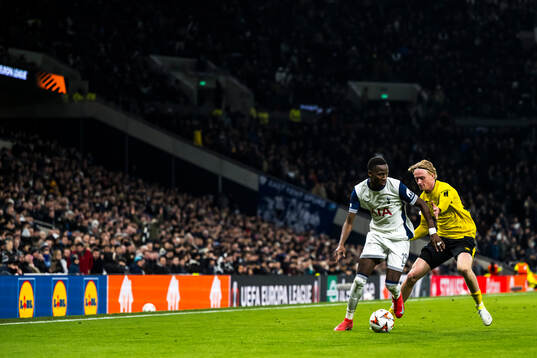 Pape Matar Sarr of Tottenham Hotspur and Ludvig Richtnér