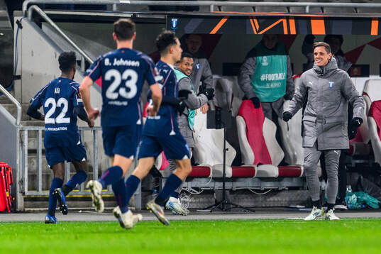 Søren Rieks and Taha Ali of Malmö FF celebrate