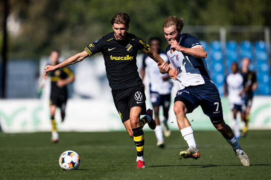 Anton Salétros of AIK and Mads Emil Madsen of AGF Århus