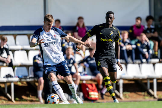Frederik Tingager of AGF Århus and Emmanuel Gono of AIK