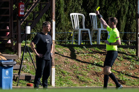 Head coach Mikkjal Thomassen of AIK receives a yellow card
