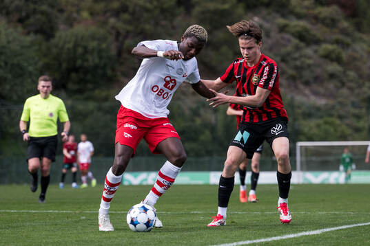 Maxwell Woledzi of Fredrikstad and Love Arrhov of