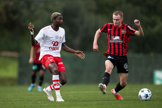 Maxwell Woledzi of Fredrikstad and Victor Lind of