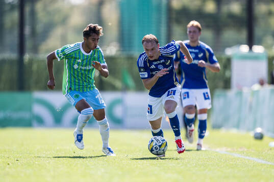 Danny Leyva of Seattle Sounders FC and Marcus Baggesen of
