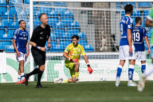 Moutaz Neffati and Goalkeeper David Andersson of IFK