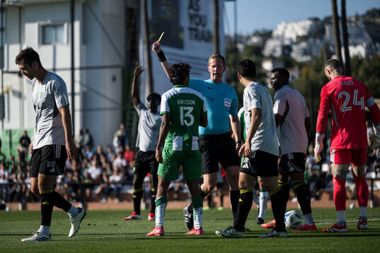 Jonathan Karlsson of Hammarby receives a yellow card