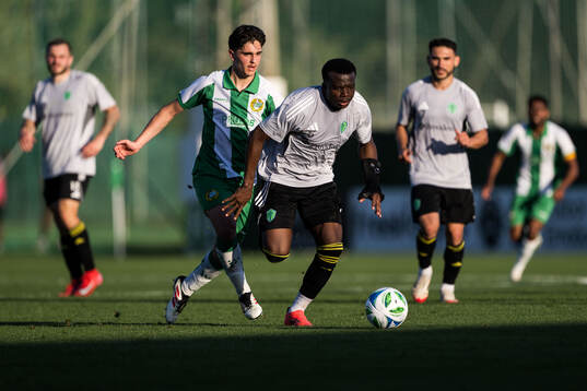 Adrian Lahdo of Hammarby and Nouhou of Seattle Sounders FC