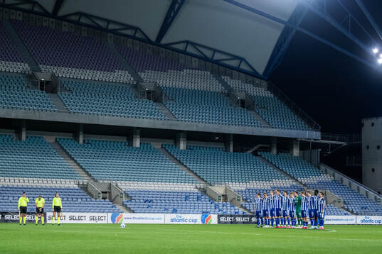 Players of IFK Göteborg in a minute of silence to honor