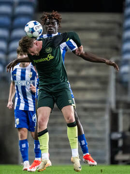 Caelan Avenell of Brentford B and Rockson Yeboah of IFK