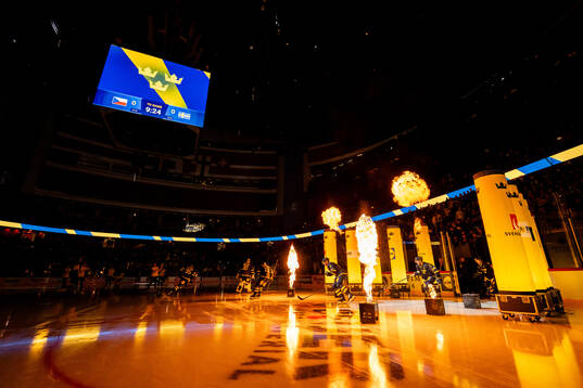 Players of Sweden enters the ice