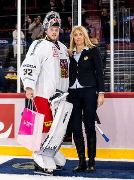 Goaltender Josef Korenar of Czech Republic is awarded