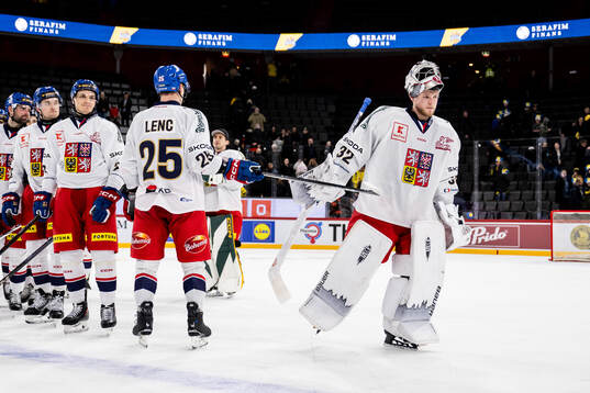 Goaltender Josef Korenar of Czech Republic is awarded