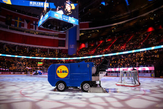Zambonis preparing the ice