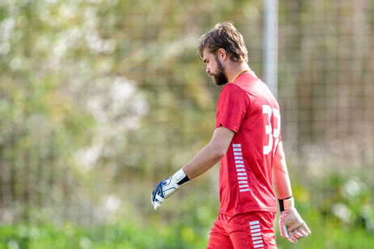 Goalkeeper Victor Astor looks dejected