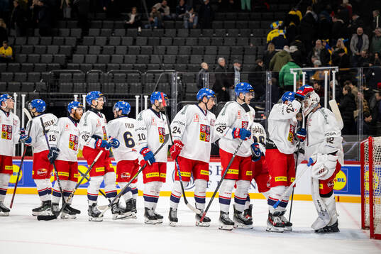 Pavel Kousal and goaltender Josef Korenar of Czech Republic