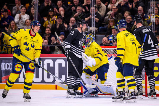 Jiri Tlusty  of NHL Alumni with Mats Sundin and goaltender