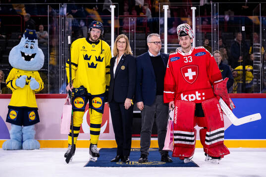 Dennis Everberg of Sweden and goaltender Kevin Pasche of