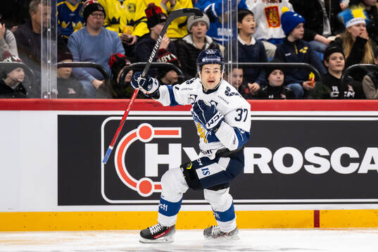 Eemil Erholtz of Finland celebrates