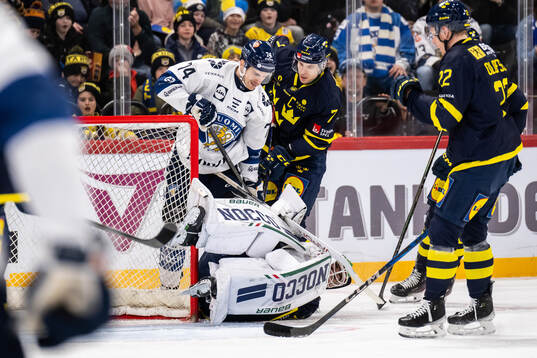 Atro Leppänen of Finland and goalkeeper Arvid Holm of