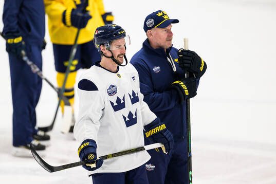 Erik Karlsson and assistant coach Daniel Alfredsson of
